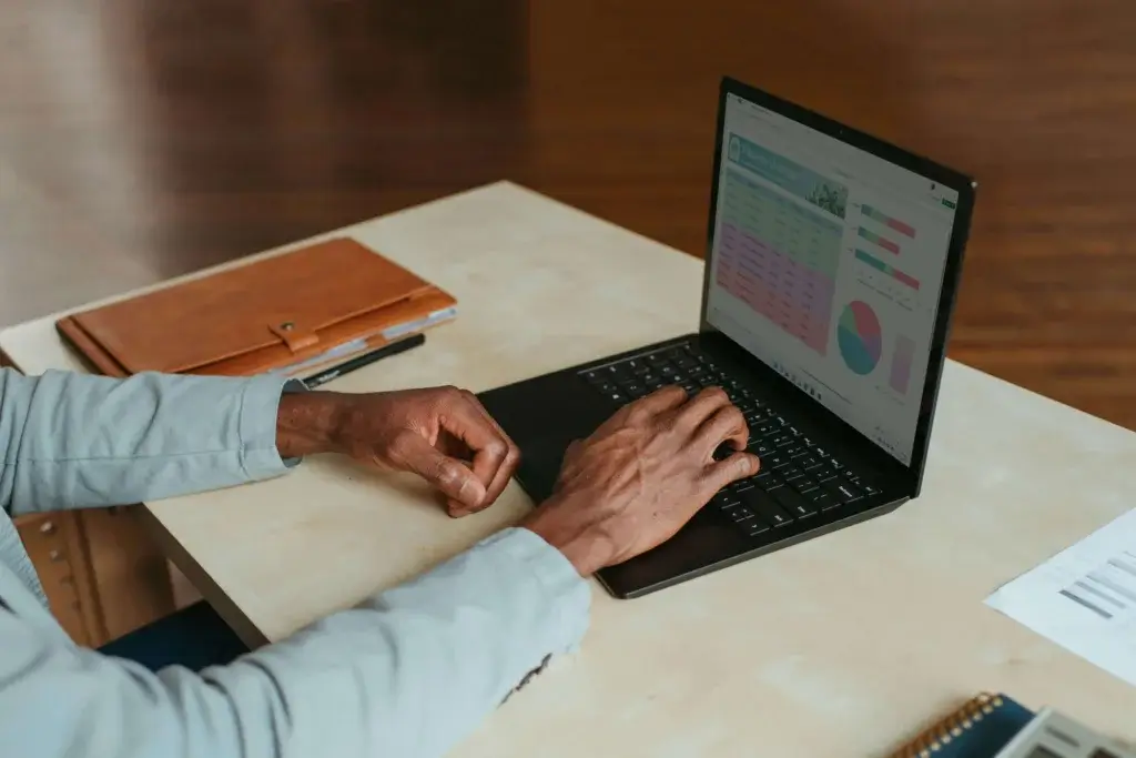 a man is working remotely on his laptop