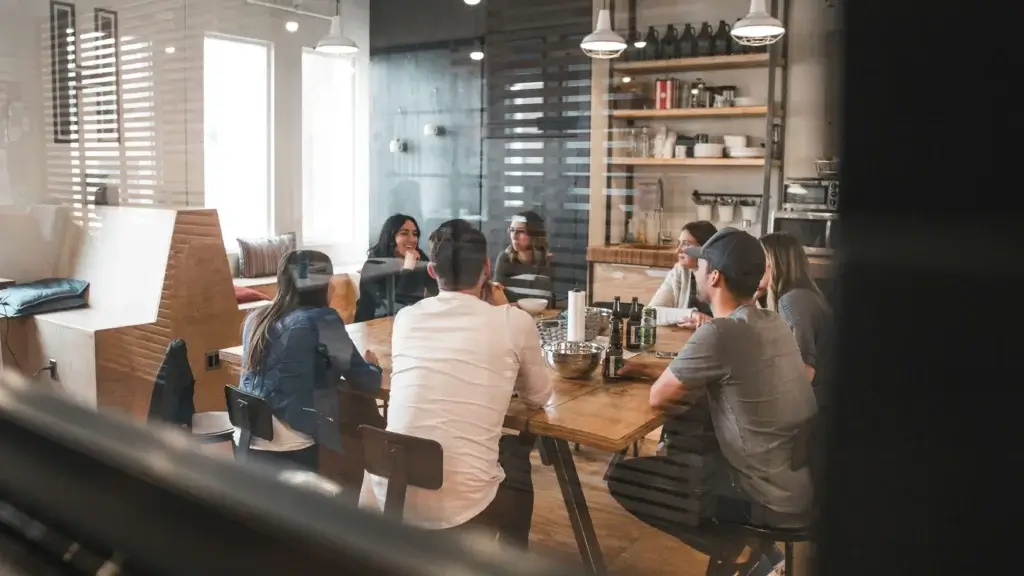 a meeting in a workplace with a conference room