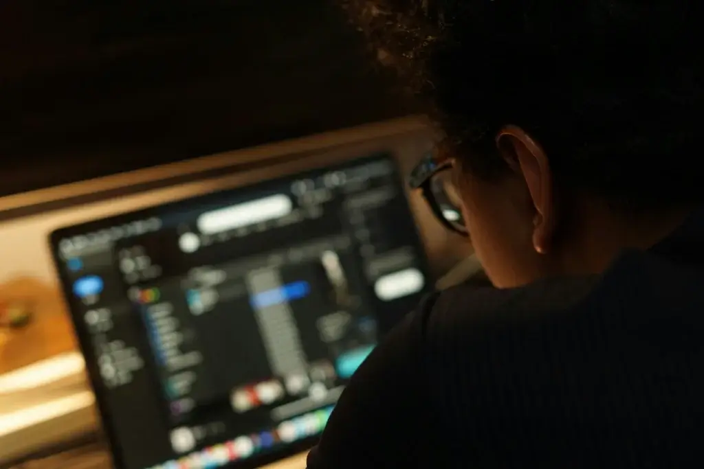 a person is looking at her laptop loking through the files