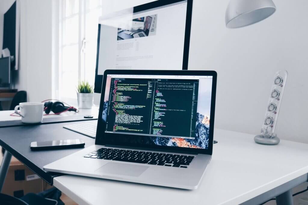 a developer's workplace with a laptop, which is one of the best career for work-life balance