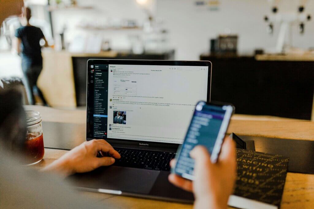 a person which working and chatting at the same time, which demonstrates poor work-life balance