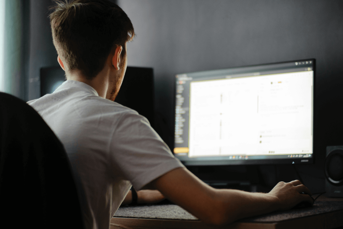 Man working from a desktop in a home office, illustrating a focused approach to how to find remote work.
